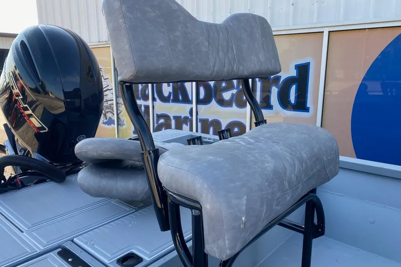 Slide: The Image of 2026 G3 Bay 21 GX boat seat and motor, displayed at Blackbeard Marine. - 7