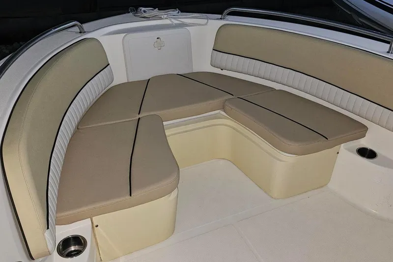 Slide: The Image of 2016 Barracuda 188 CCR boat interior with beige cushioned seating. - 15