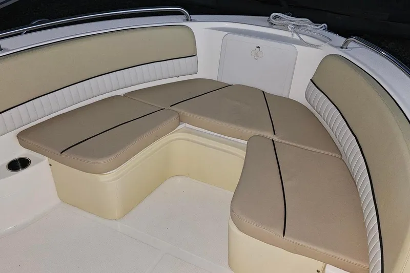 Slide: The Image of 2016 Barracuda 188 CCR boat interior with beige cushioned seating. - 16