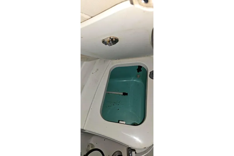 Slide: The Image of Interior compartment of a 2016 Barracuda 188 CCR boat, showing storage area. - 17