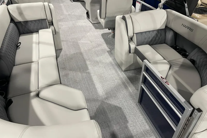 Slide: The Image of Luxurious interior of 2026 Harris Cruiser 230 CW pontoon boat with plush seating. - 5