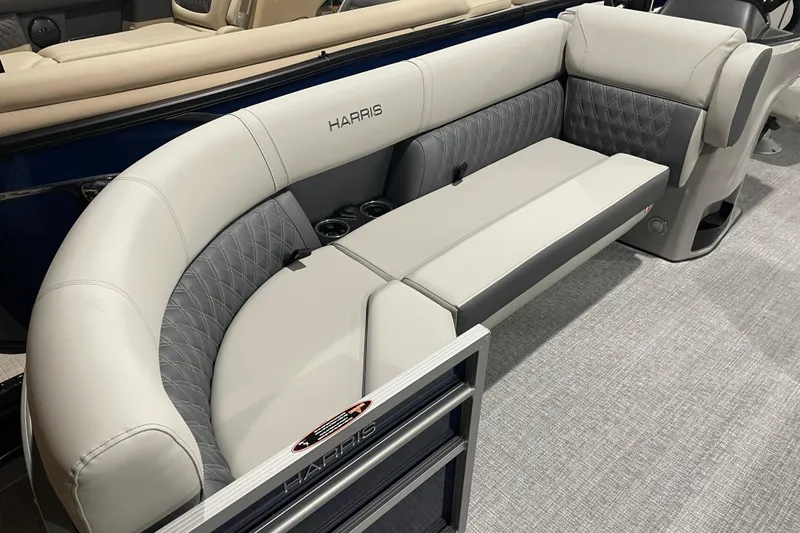 Slide: The Image of 2026 Harris Cruiser 230 CW boat interior with luxurious seating and cup holders. - 6