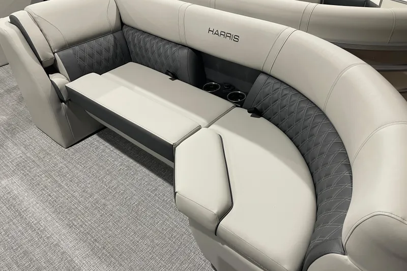 Slide: The Image of Luxurious seating on 2026 Harris Cruiser 230 CW boat with quilted upholstery and cup holders. - 7