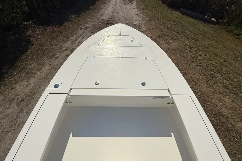Slide: The Image of 2026 Hewes 21 REDFISHER boat deck on a grassy path. - 16
