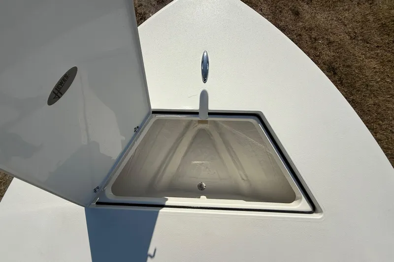 Slide: The Image of Open storage compartment on 2026 Hewes 21 REDFISHER boat, showcasing interior space. - 34