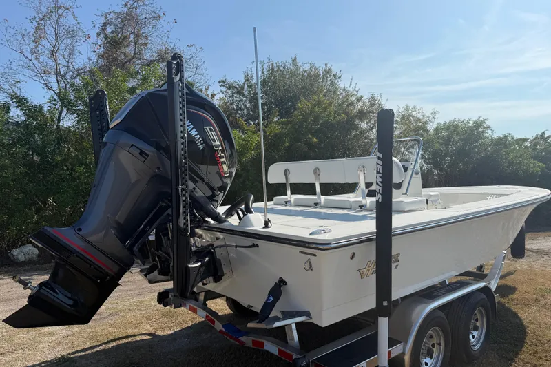 Slide: The Image of 2026 Hewes 21 REDFISHER boat on trailer with Yamaha outboard motor. - 6