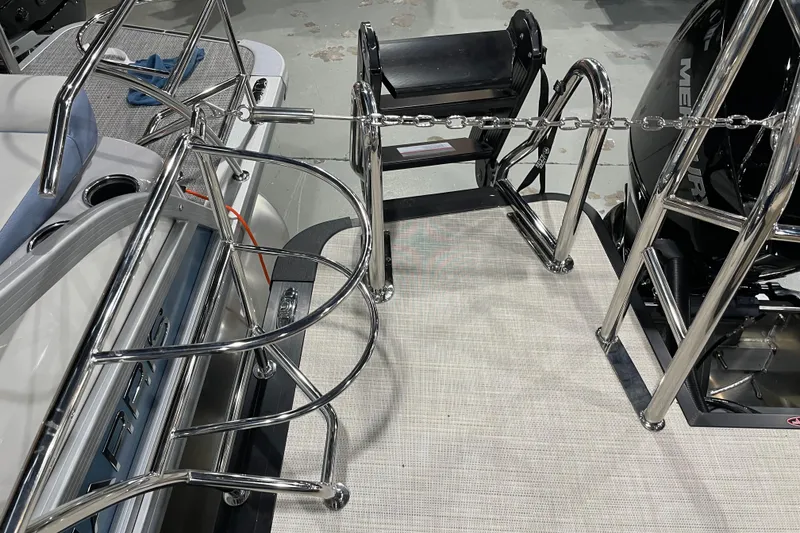 Slide: The Image of 2026 Harris SUNLINER 230 SLDH boat with stainless steel railings and motor. - 13