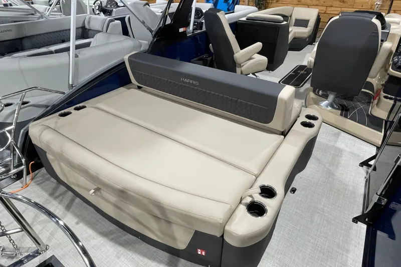Slide: The Image of 2026 Harris SUNLINER 230 SLDH boat interior with luxurious seating and cup holders. - 15