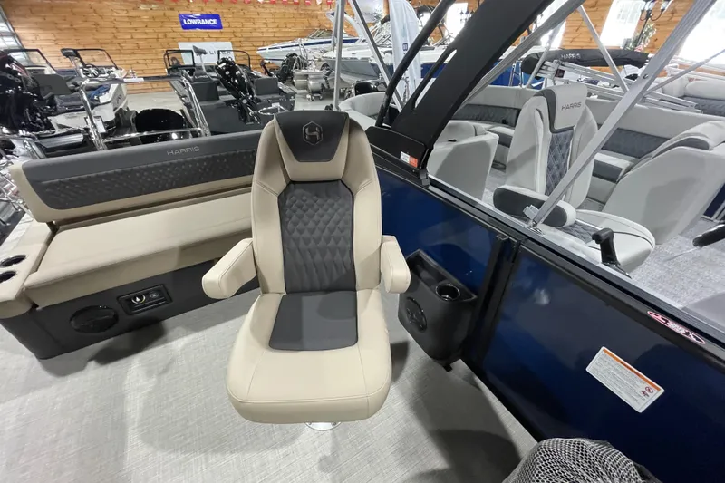 Slide: The Image of 2026 Harris SUNLINER 230 SLDH boat interior with luxurious seating and modern design. - 19