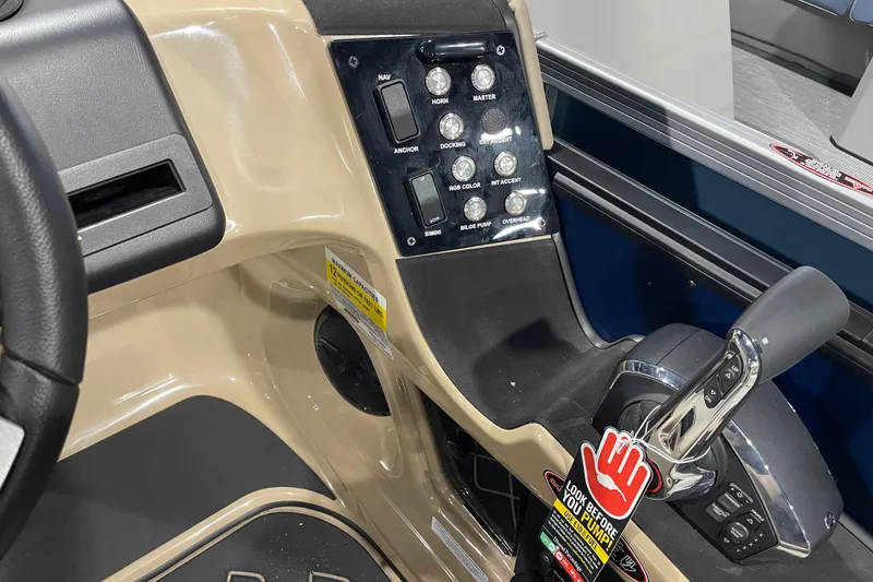 Slide: The Image of Control panel of 2026 Harris SUNLINER 230 SLDH boat with switches and throttle. - 2