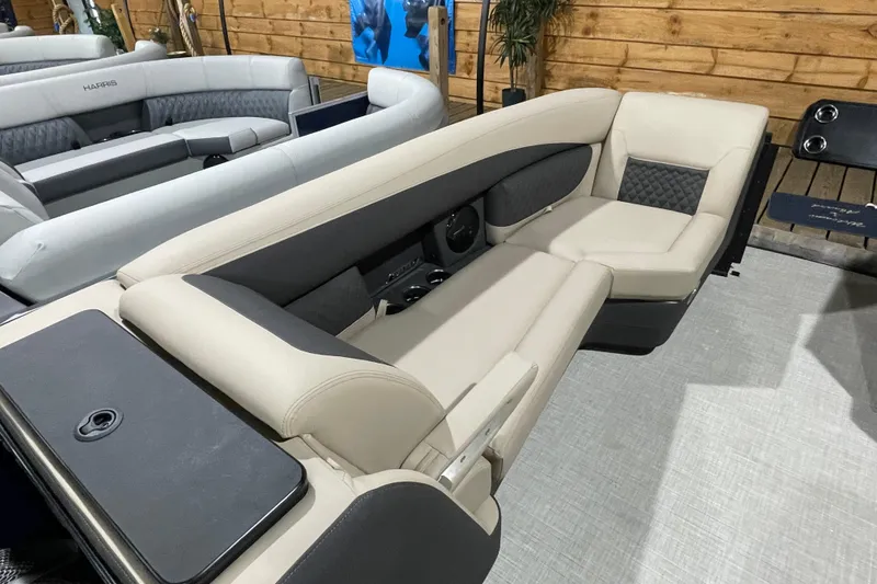 Slide: The Image of 2026 Harris SUNLINER 230 SLDH boat interior with luxurious seating and modern design. - 23
