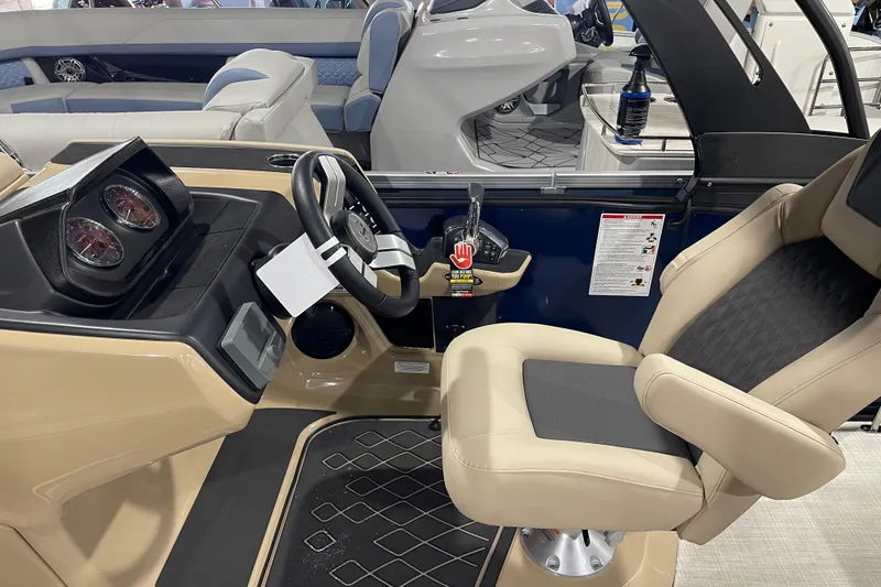 Slide: The Image of Captain's helm of 2026 Harris SUNLINER 230 SLDH, featuring modern controls and comfortable seating. - 3