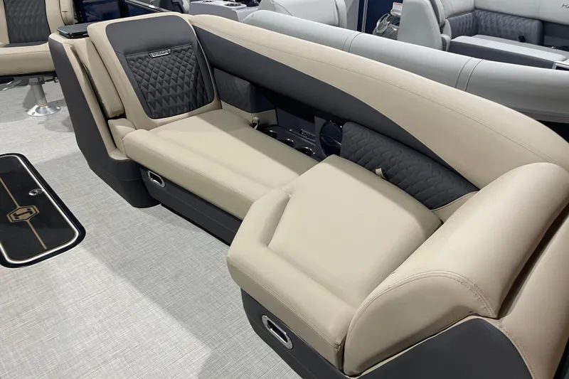 Slide: The Image of Luxurious seating on 2026 Harris SUNLINER 230 SLDH boat, featuring elegant beige and black upholstery. - 8