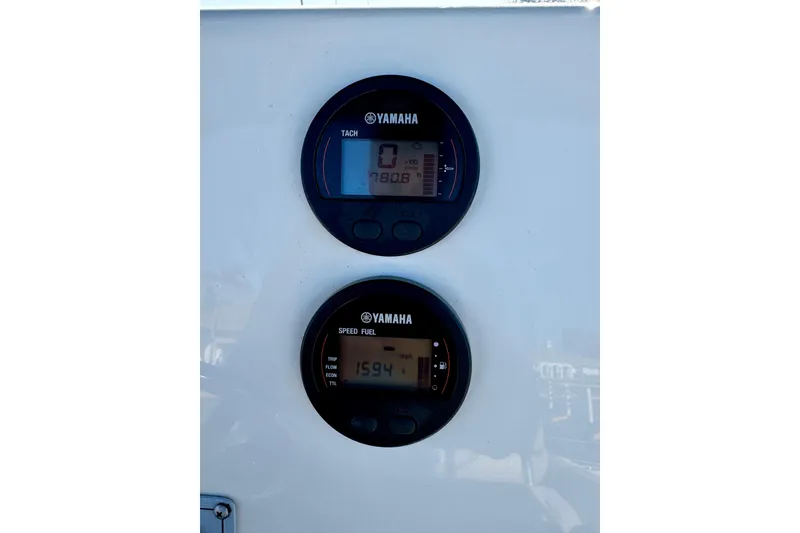 Slide: The Image of Yamaha tachometer and speed fuel gauges on 2023 Key West 239 FS boat dashboard. - 20