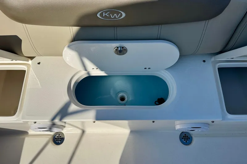 Slide: The Image of 2023 Key West 239 FS boat interior with open storage compartment. - 29
