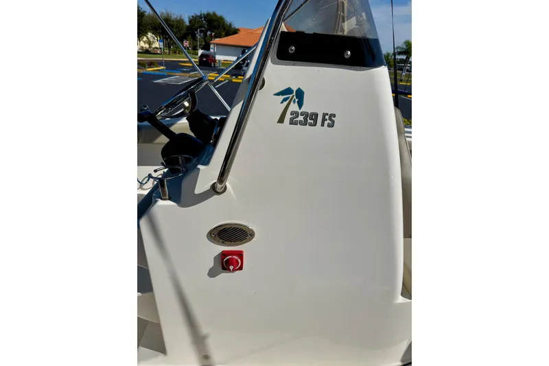 Slide: The Image of 2023 Key West 239 FS boat console with steering wheel and logo. - 32