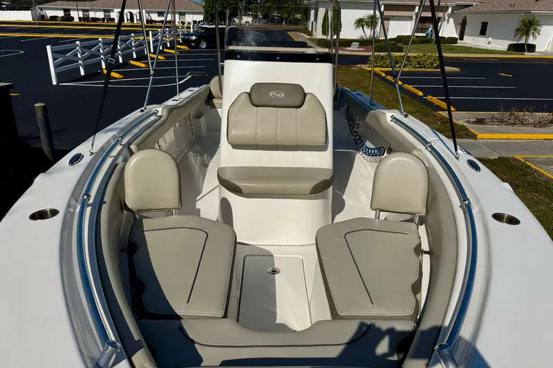 Slide: The Image of 2023 Key West 239 FS boat interior with beige seating and modern design. - 8