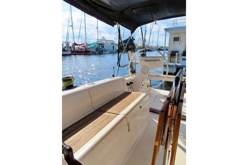 Slide: The Image of 2015 Salona 35 sailboat cockpit with steering wheel, docked at marina. - 10