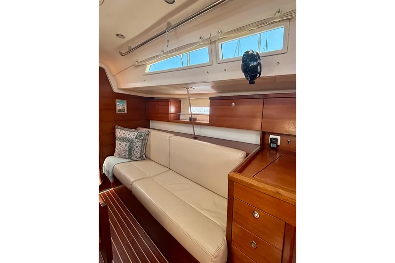 Slide: The Image of Interior of 2015 Salona 35 yacht with beige sofa and wooden cabinetry. - 18