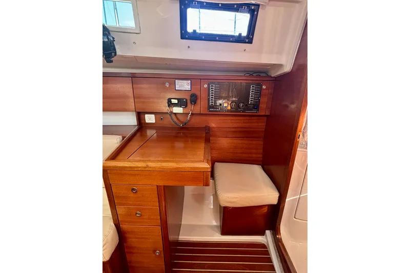 Slide: The Image of Interior of 2015 Salona 35 yacht with navigation station and wooden cabinetry. - 20
