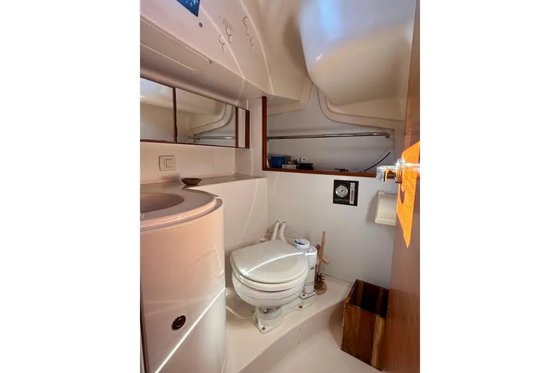 Slide: The Image of Compact bathroom in 2015 Salona 35 yacht, featuring toilet and sink. - 27