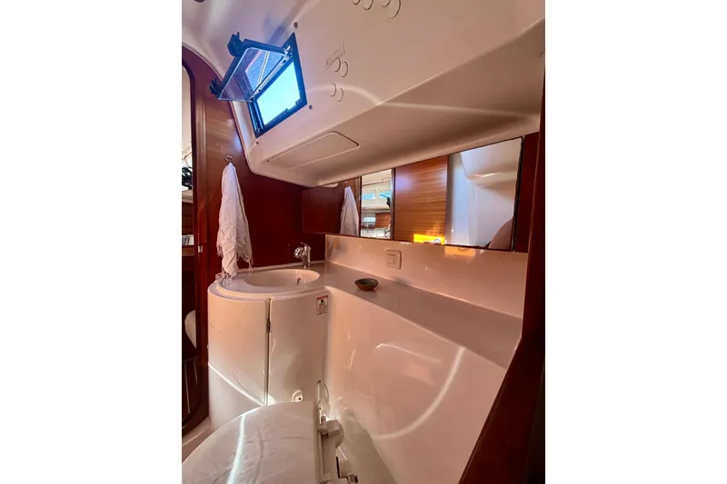 Slide: The Image of 2015 Salona 35 yacht bathroom with sink, mirror, and towel. - 28