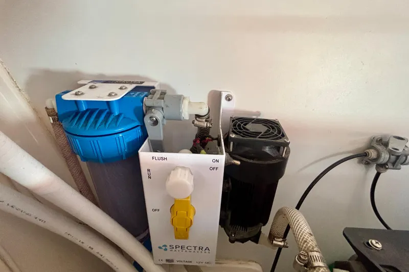 Slide: The Image of Spectra watermaker system on a 2015 Salona 35 yacht, featuring control panel and filter. - 30