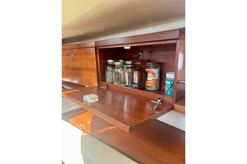 Slide: The Image of Wooden cabinet in 2015 Salona 35 yacht, storing jars and bottles. - 33
