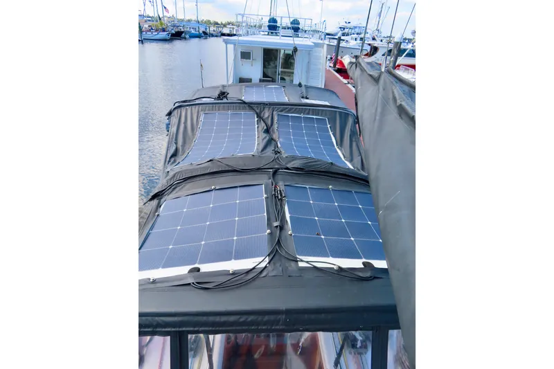 Slide: The Image of 2015 Salona 35 sailboat with solar panels on deck, docked in a marina. - 4