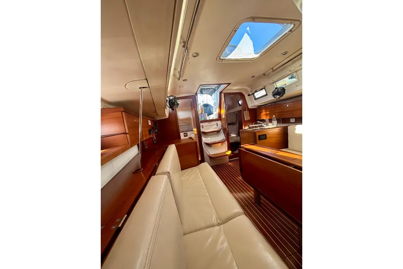 Slide: The Image of Interior of 2015 Salona 35 yacht, featuring elegant wood finishes and comfortable seating. - 40