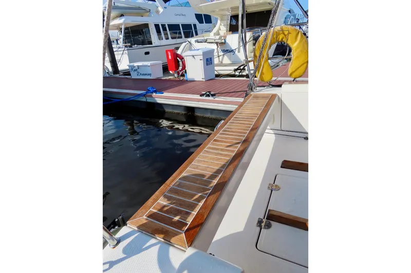 Slide: The Image of 2015 Salona 35 yacht docked with wooden gangway and safety equipment. - 6