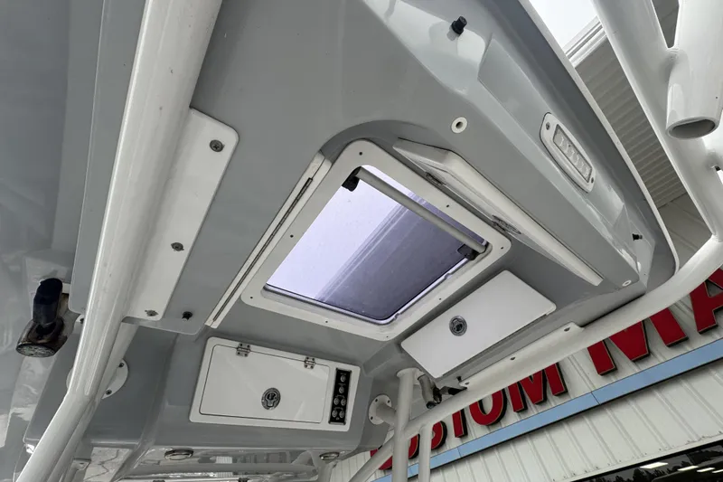 Slide: The Image of 2018 Sea Fox 268 Commander boat interior ceiling with hatch and storage compartments. - 15