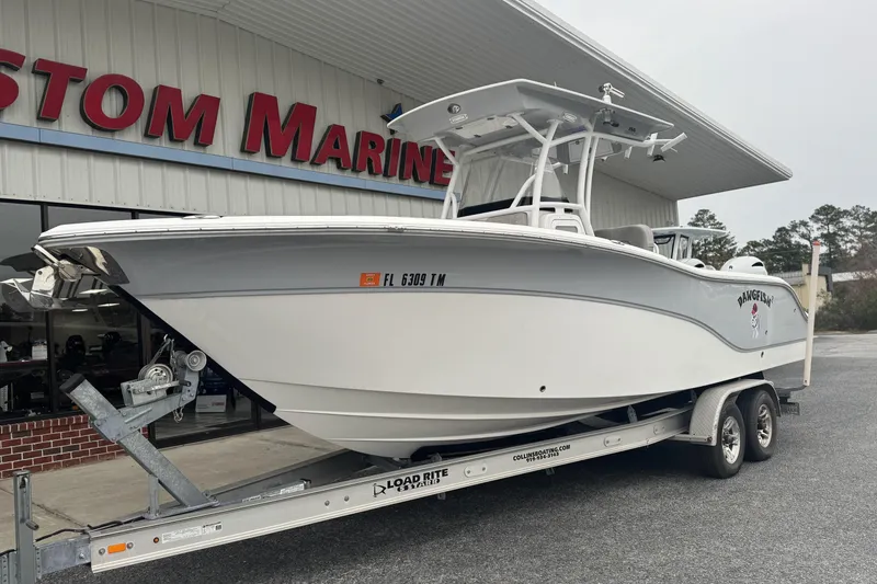 Slide: The Image of 2018 Sea Fox 268 Commander boat on trailer outside marine store. - 4