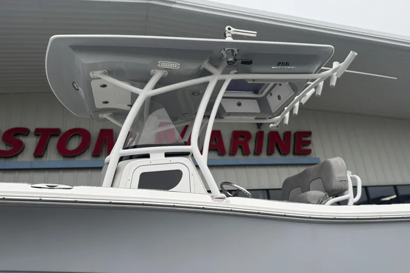 Slide: The Image of 2018 Sea Fox 268 Commander boat displayed at a marine dealership. - 5