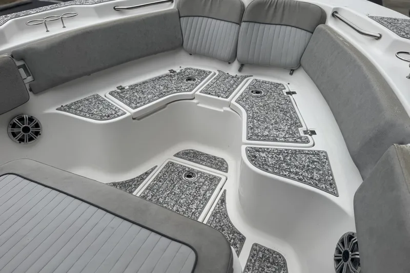 Slide: The Image of 2018 Sea Fox 268 Commander boat interior with cushioned seating and textured flooring. - 9