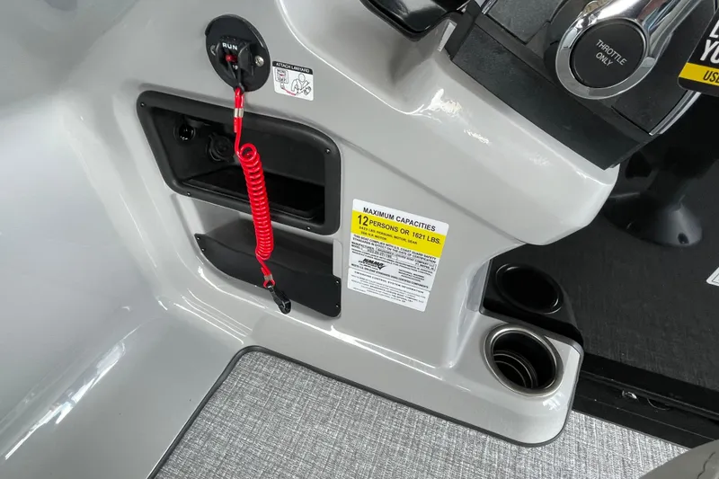 Slide: The Image of Control panel of 2026 Harris Cruiser 230 boat with safety features and capacity label. - 11