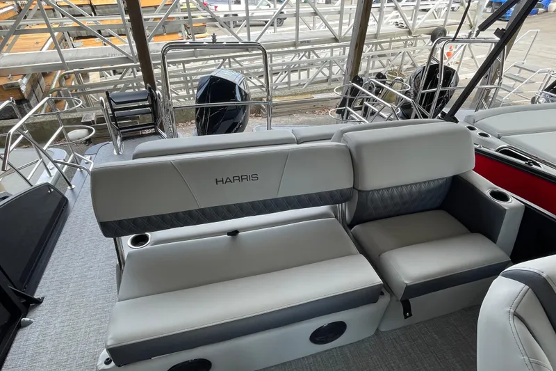 Slide: The Image of 2026 Harris Cruiser 230 boat interior with plush seating and modern design. - 12