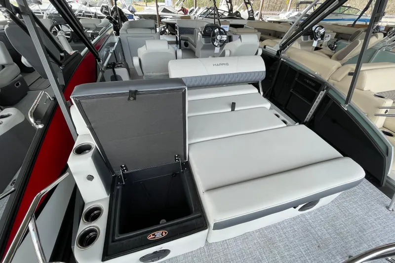 Slide: The Image of 2026 Harris Cruiser 230 interior with spacious seating and storage compartments. - 16