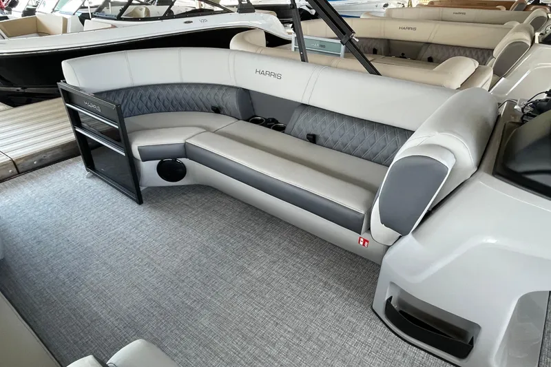 Slide: The Image of Luxurious seating on 2026 Harris Cruiser 230 pontoon boat, featuring elegant gray upholstery. - 3