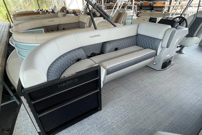 Slide: The Image of 2026 Harris Cruiser 230 pontoon boat with luxurious seating and modern design. - 6