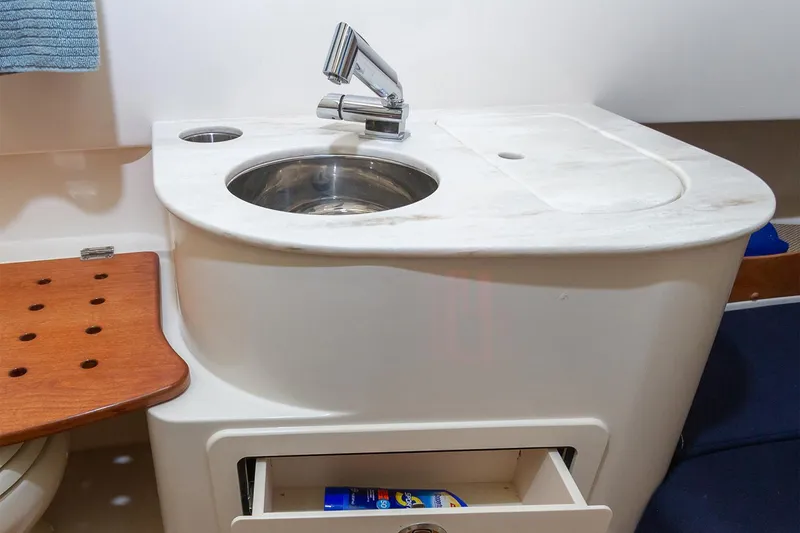 Slide: The Image of 2026 Grady-White Canyon 336 boat, front deck view in harbor. - 11