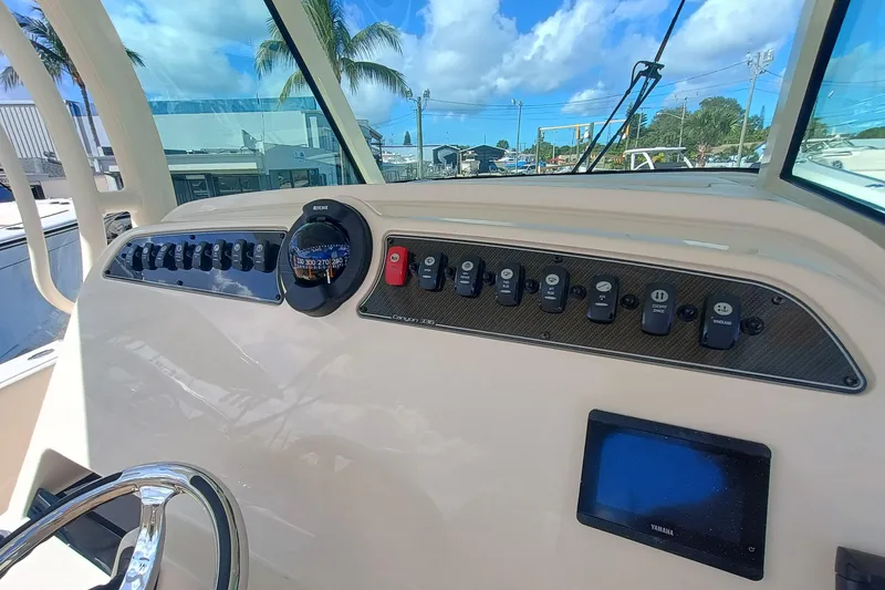 Slide: The Image of Dashboard of Grady-White Canyon 336 boat, year 2026. - 20