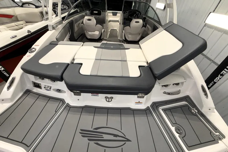 Slide: The Image of 2021 Chaparral 21 SSi boat interior with gray and white seating and sleek design. - 10