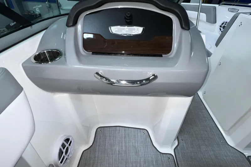 Slide: The Image of 2021 Chaparral 21 SSi boat interior with cup holder and speaker. - 14