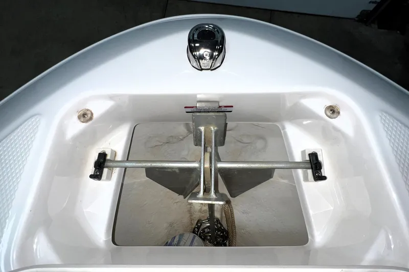 Slide: The Image of Anchor compartment of 2021 Chaparral 21 SSi boat, featuring secure storage and modern design. - 20