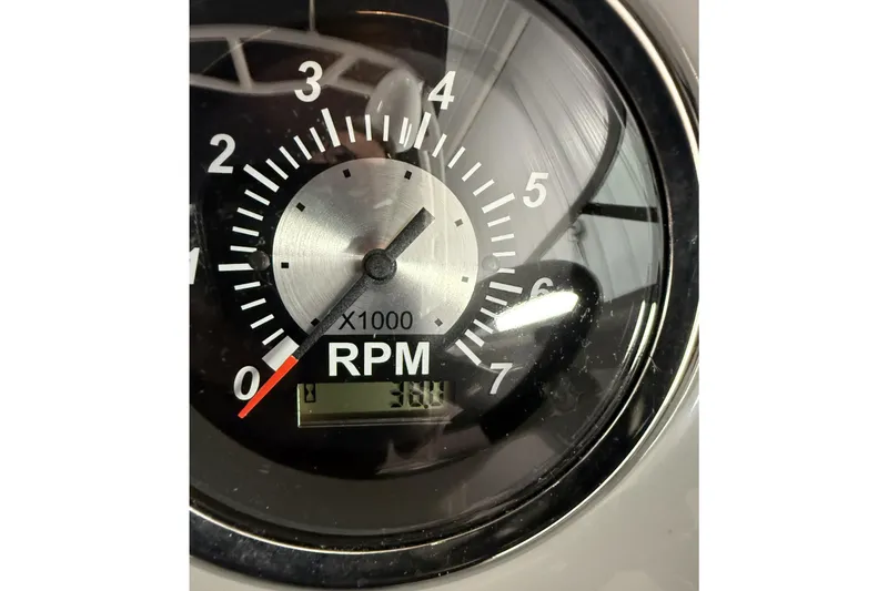 Slide: The Image of Tachometer of 2021 Chaparral 21 SSi showing 300 RPM. - 26