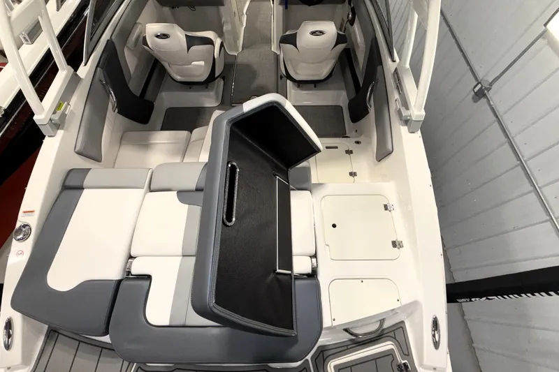 Slide: The Image of 2021 Chaparral 21 SSi boat interior with white and gray seating arrangement. - 9