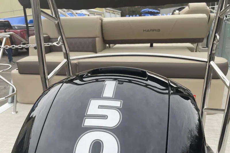 Slide: The Image of 2026 Harris Cruiser 230 boat with 150 horsepower engine, featuring luxurious seating. - 13