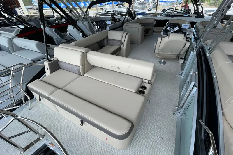 Slide: The Image of 2026 Harris Cruiser 230 pontoon boat interior with luxurious seating and modern design. - 19