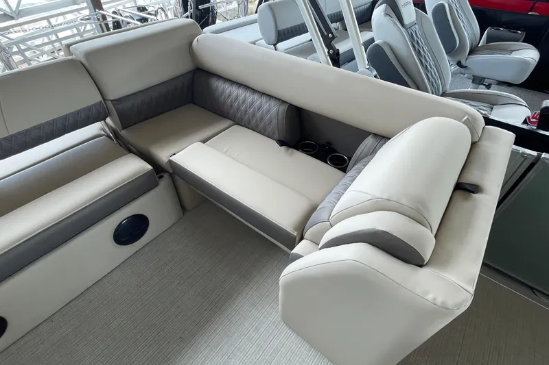 Slide: The Image of Luxurious seating on 2026 Harris Cruiser 230 pontoon boat with cup holders and modern design. - 22
